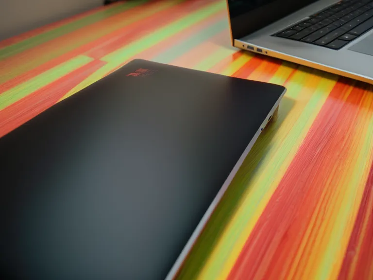 Close-up of a code editor and headphones during a deep focus freelance coding session